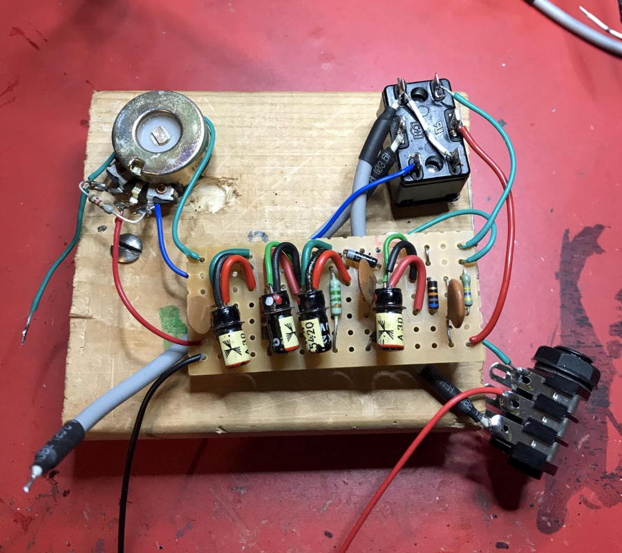 Circuitboard on a workbench with vintage transistors, wires