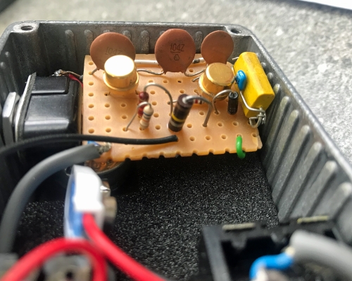 Good Fuzzy Sounds 2.Bad fuzz pedal guts showing a circuit board, wires and components.